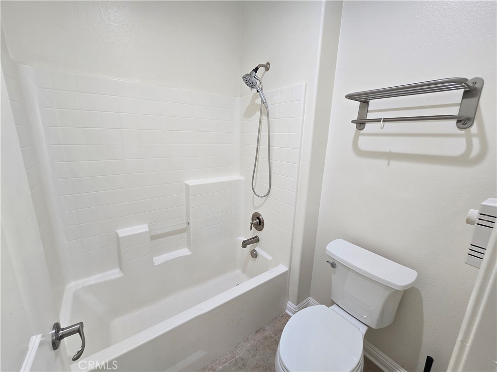 220 West Via Rua Flores Ontario, CA 91762 - Photo 40 of 51 a bathroom with a toilet and a bath tub
