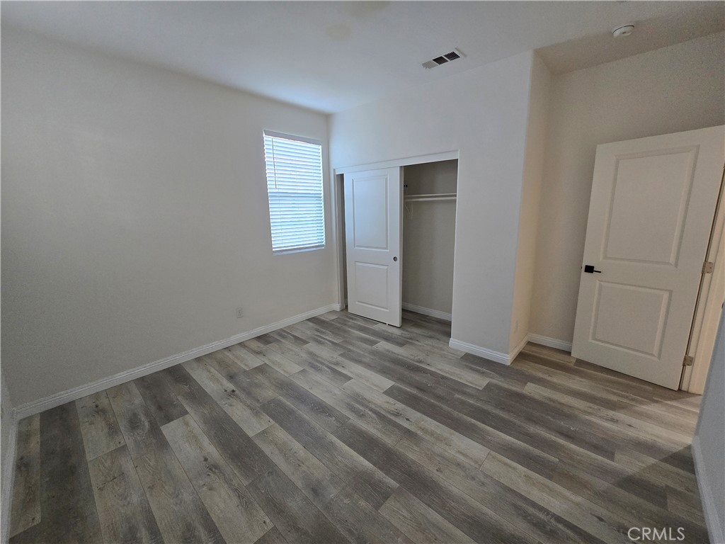 220 West Via Rua Flores Ontario, CA 91762 - Photo 43 of 51 a view of a room with wooden floor and window