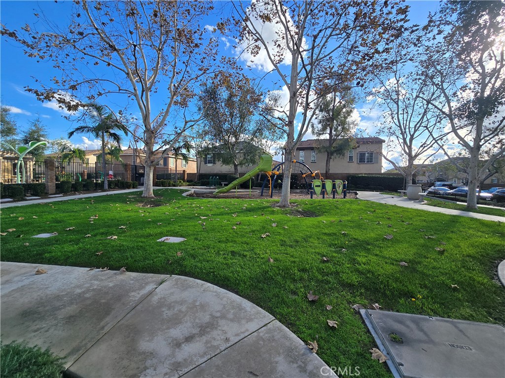 220 West Via Rua Flores Ontario, CA 91762 - Photo 49 of 51 front view of a building with a yard