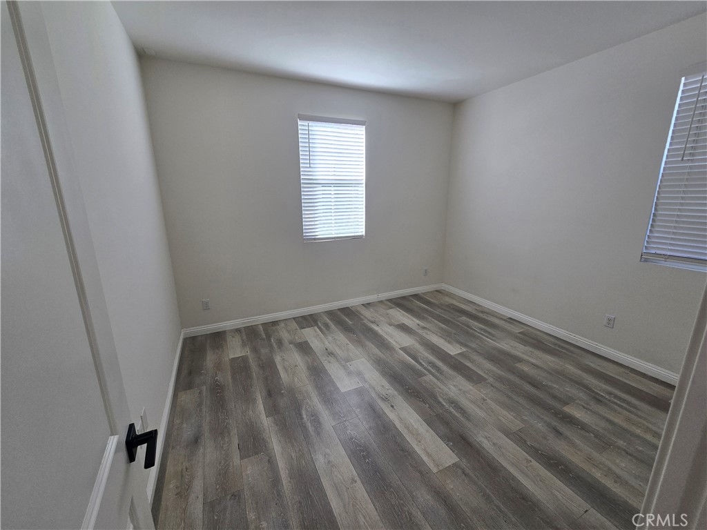 220 West Via Rua Flores Ontario, CA 91762 - Photo 5 of 51 a view of a room with wooden floor and window