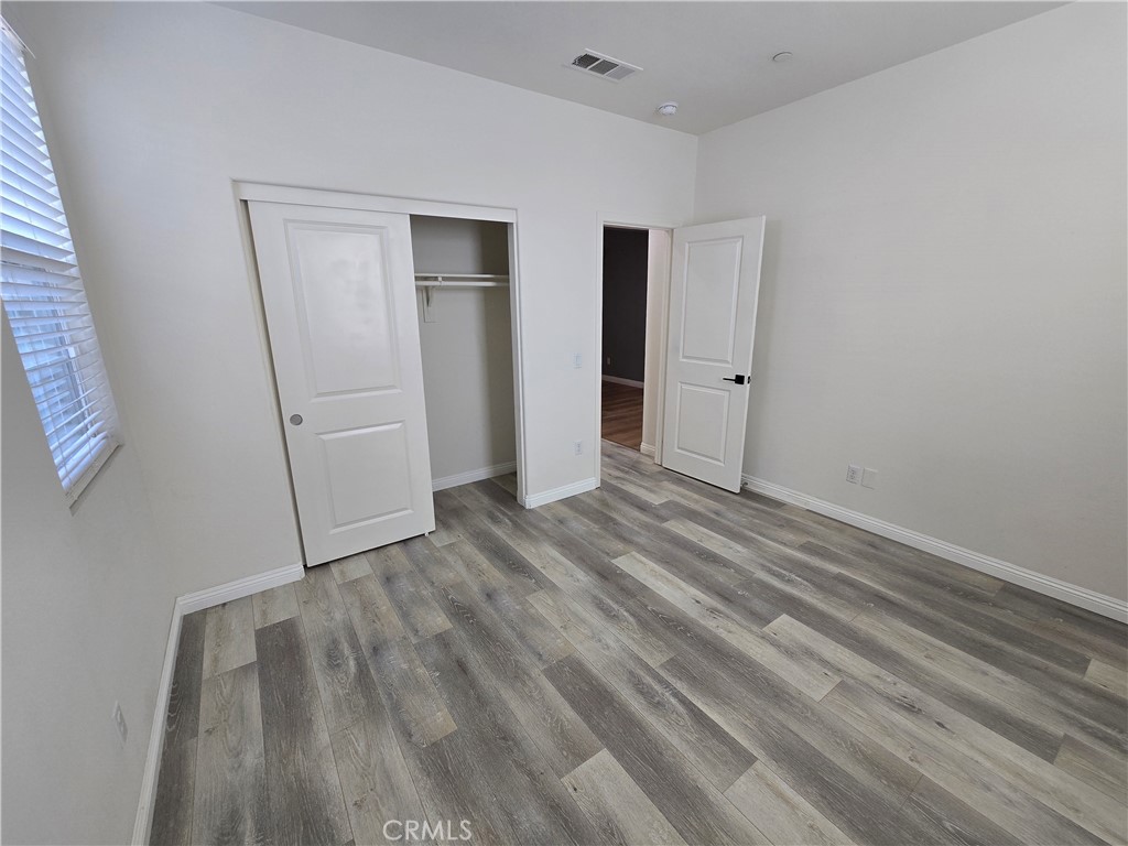 220 West Via Rua Flores Ontario, CA 91762 - Photo 8 of 51 a view of empty room with wooden floor