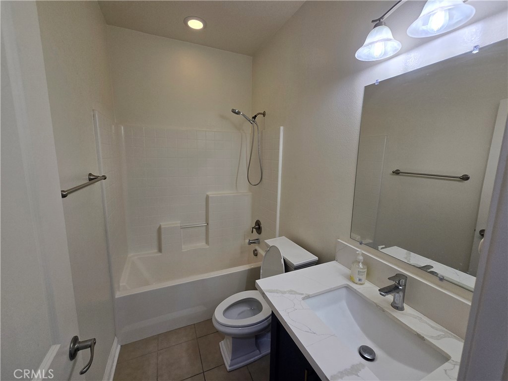 220 West Via Rua Flores Ontario, CA 91762 - Photo 9 of 51 a bathroom with a sink a toilet and shower
