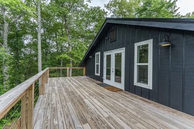 a view of a livingroom with furniture and a flat screen tv
