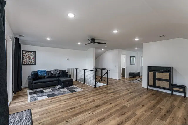 a view of a hallway with a white stove a washer and dryer