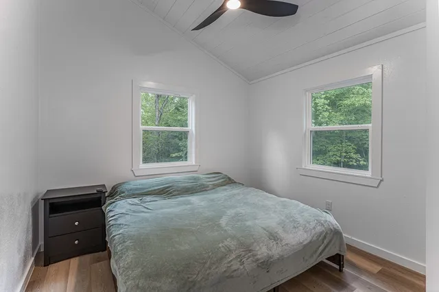 a view of a green yard with an outdoor seating