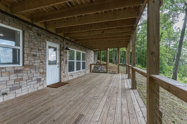 a kitchen with stainless steel appliances granite countertop a stove top oven a sink and a refrigerator