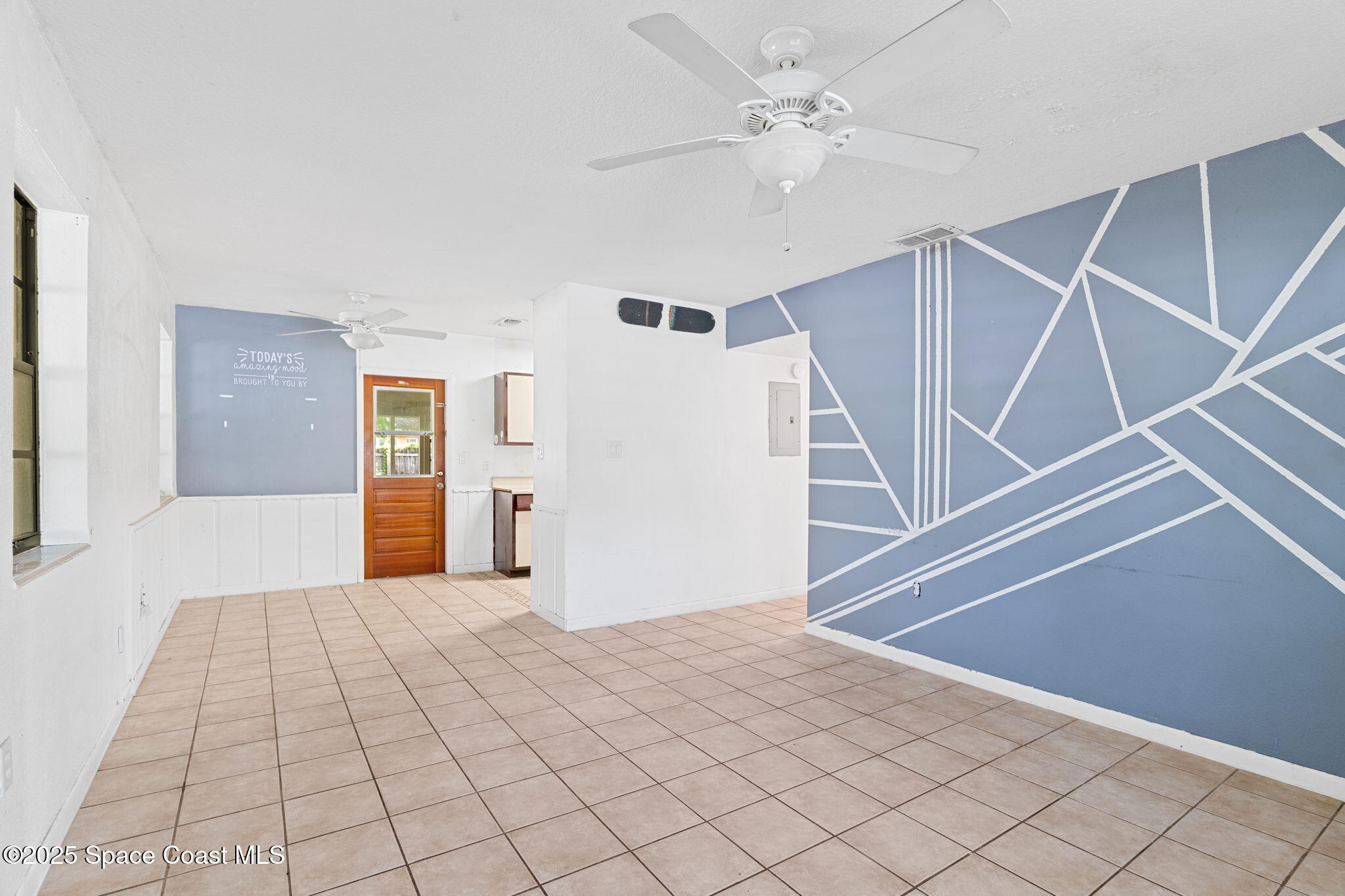 504 Cornell Avenue Melbourne, FL 32901 - Photo 13 of 24 a view of an empty room with wooden floor