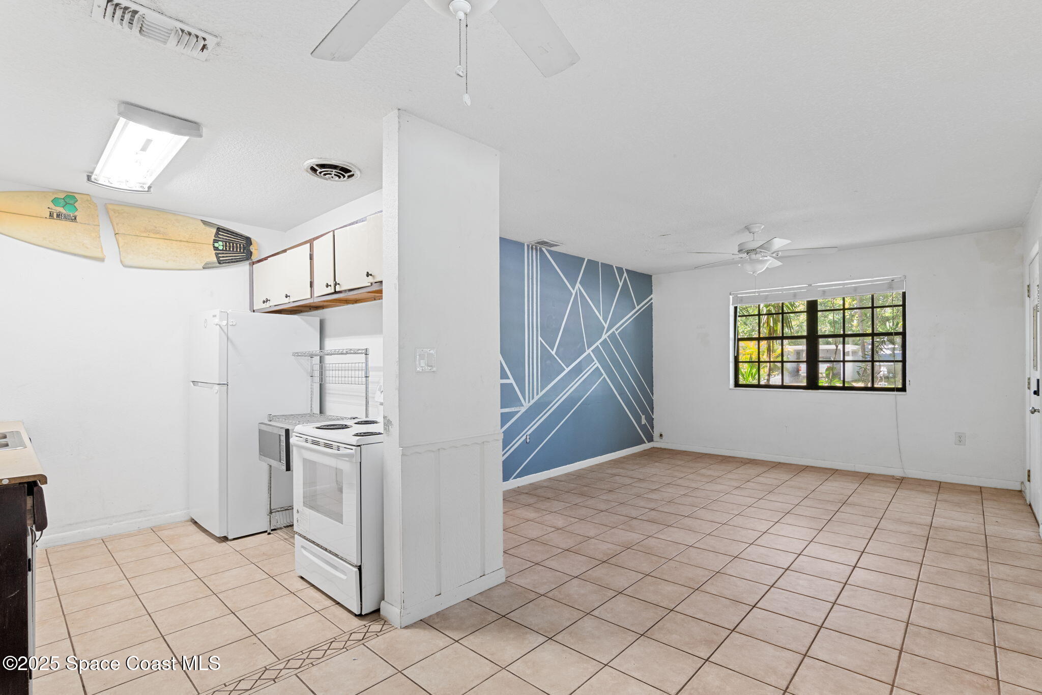 504 Cornell Avenue Melbourne, FL 32901 - Photo 14 of 24 an empty room with windows