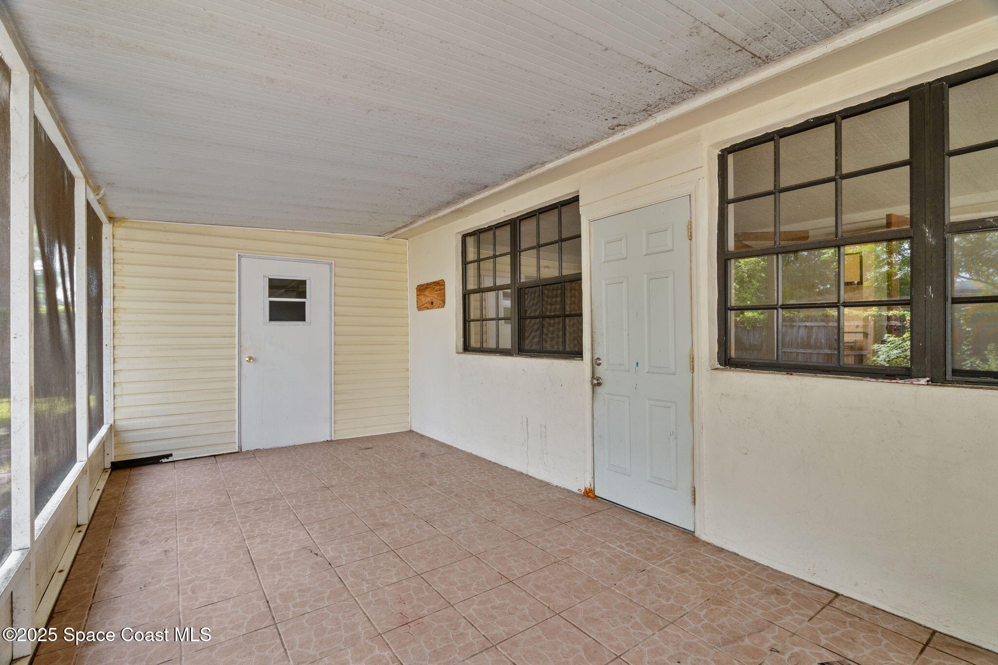 504 Cornell Avenue Melbourne, FL 32901 - Photo 20 of 24 a view of an empty room with a window and outer view