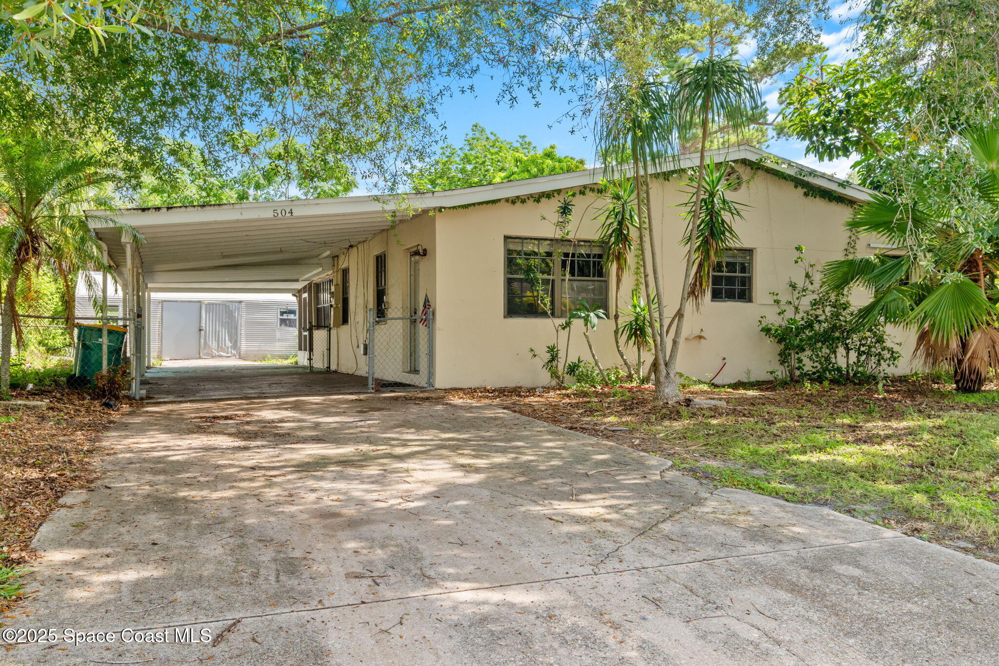 504 Cornell Avenue Melbourne, FL 32901 - Photo 2 of 24 a view of a house with yard and plants