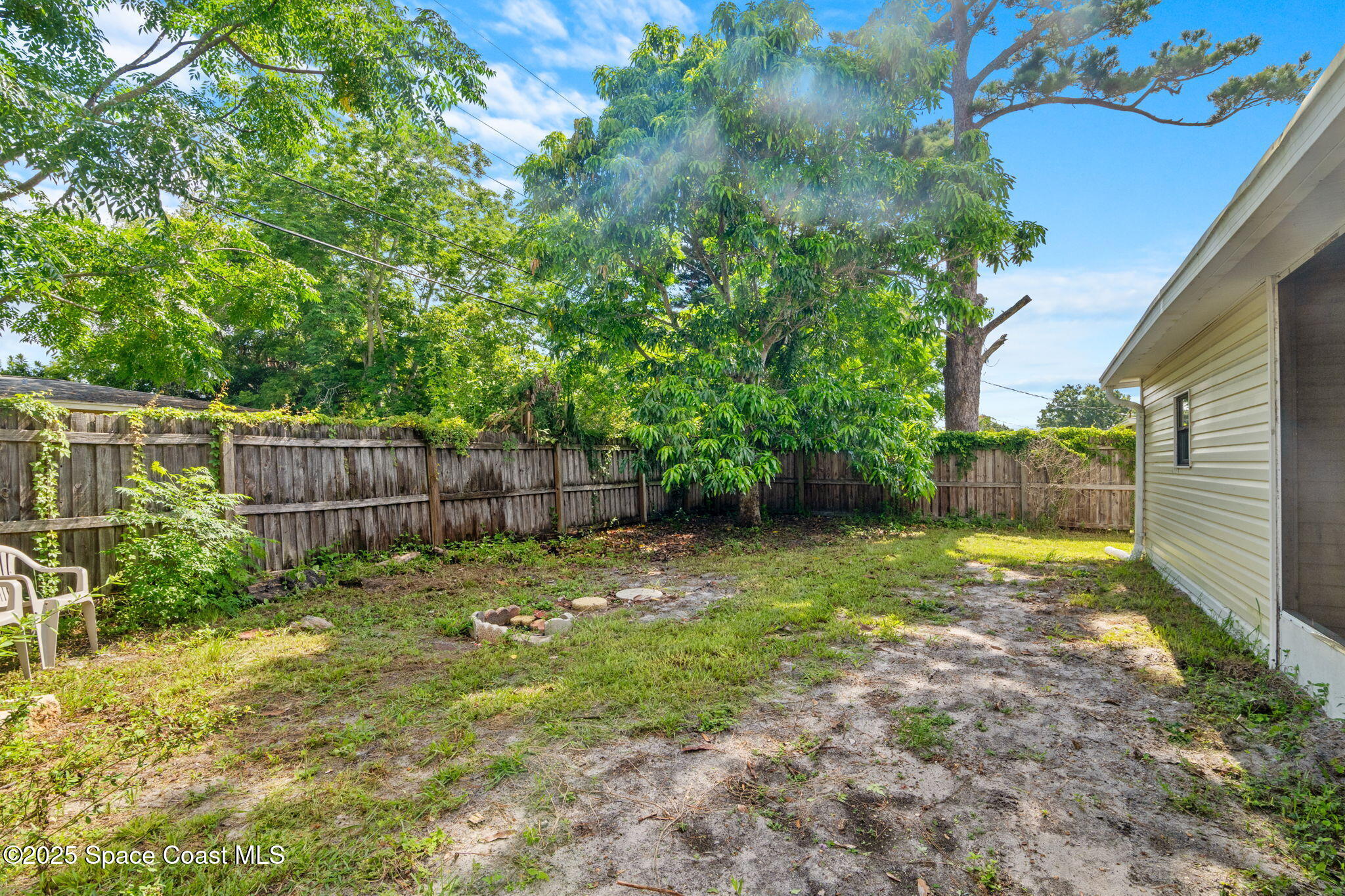 504 Cornell Avenue Melbourne, FL 32901 - Photo 24 of 24 a view of a backyard with a trees and plants