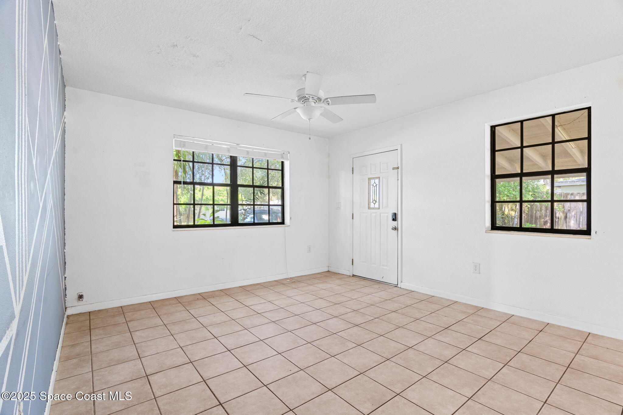 504 Cornell Avenue Melbourne, FL 32901 - Photo 6 of 24 a view of an empty room and window