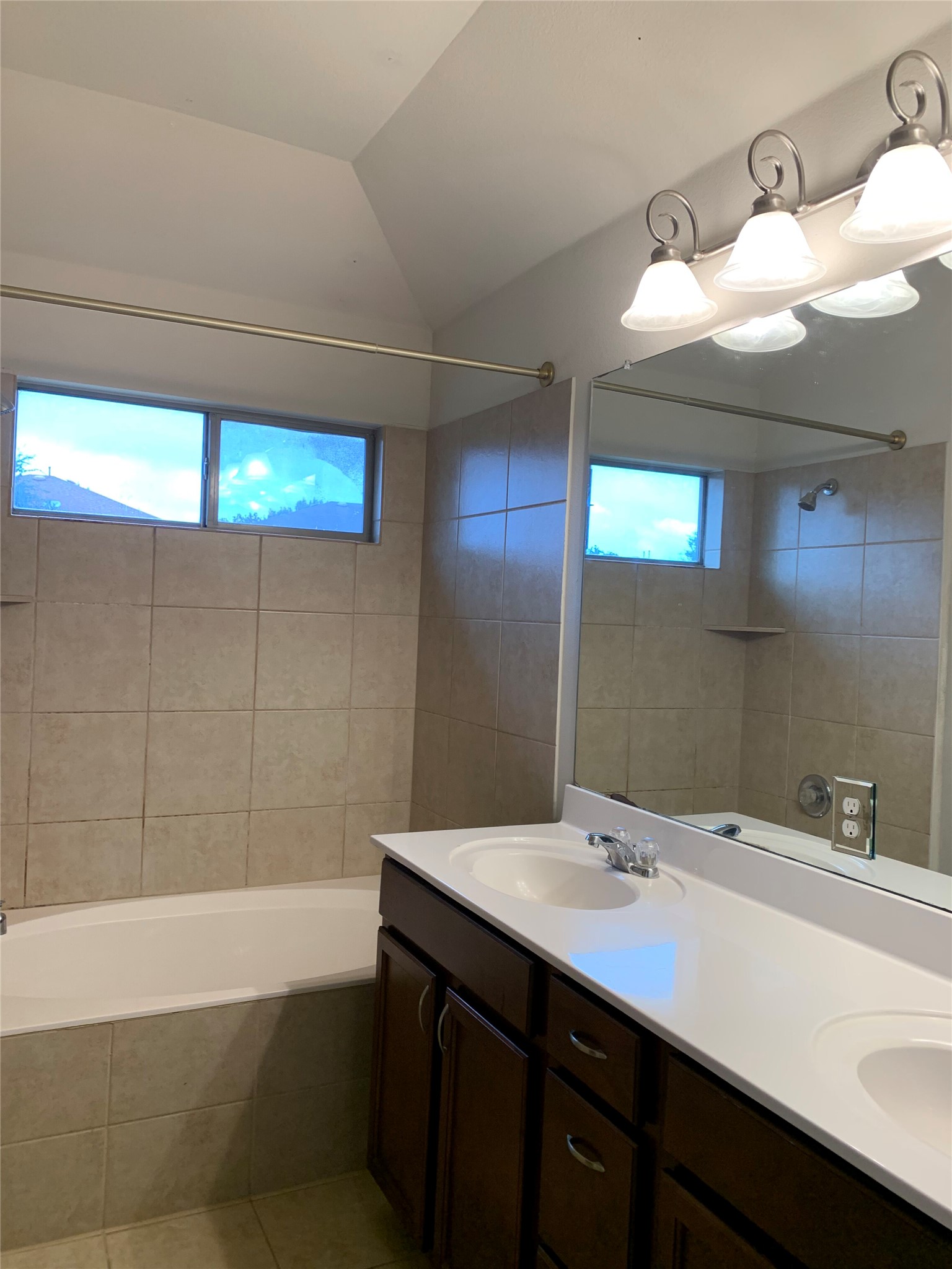 117 Antelope Plains Road Buda, TX 78610 - Photo 21 of 24 Tiled walls and a double vanity define this functional bathroom space.