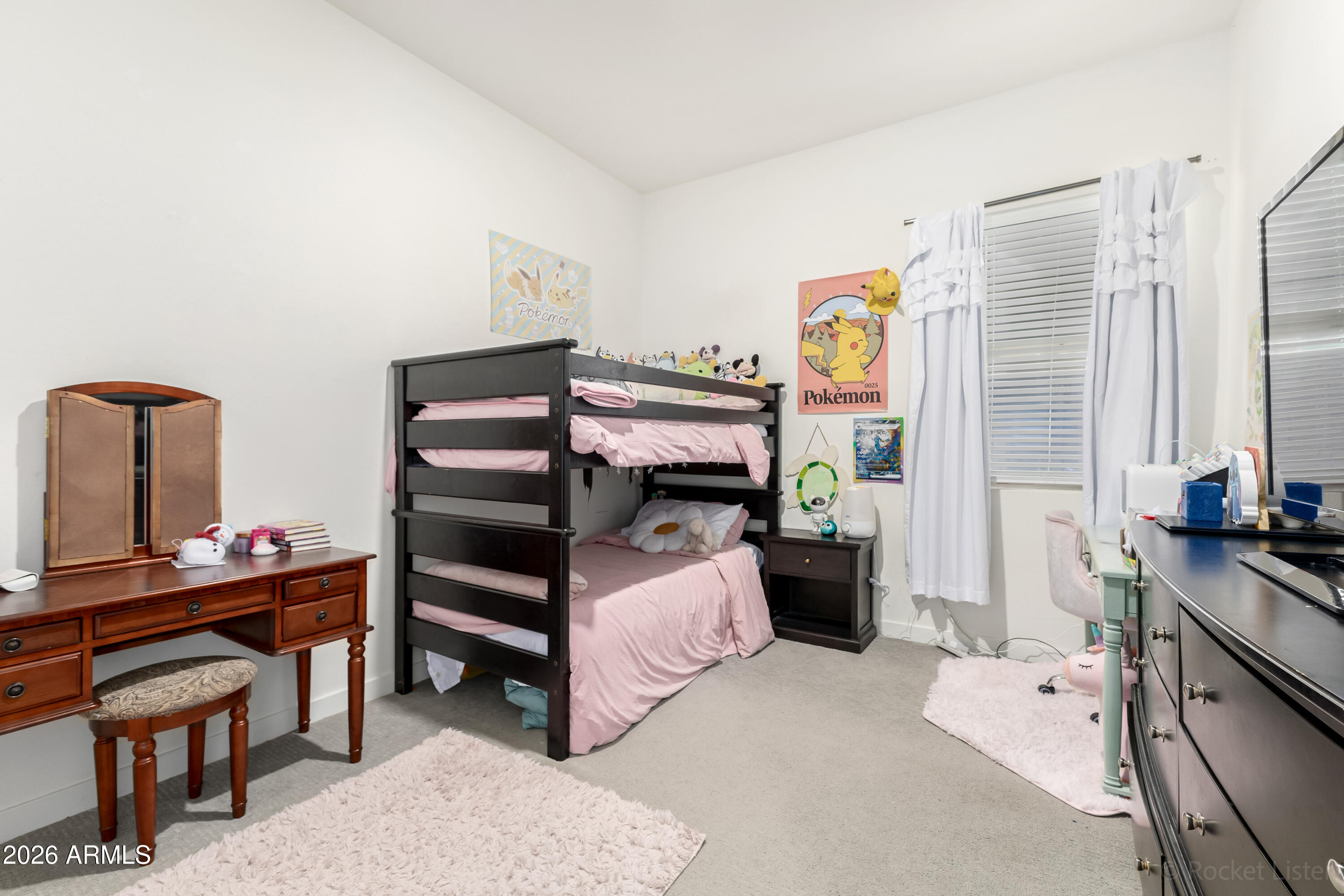 23929 North 166th Lane Surprise, AZ 85387 - Photo 13 of 23 a bedroom with a bed and a desk