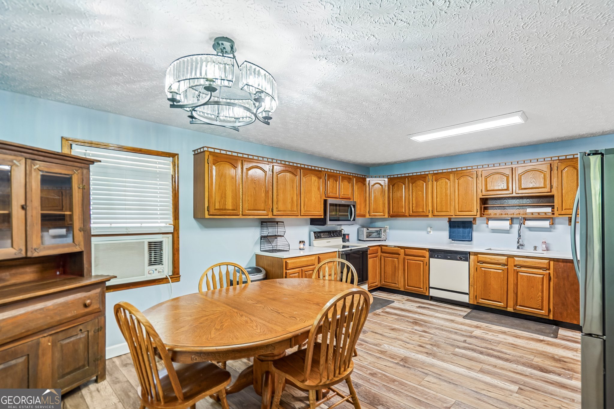 241 Busbin Road Fayetteville, GA 30215 - Photo 13 of 45 a view of a dining room with furniture window and wooden floor