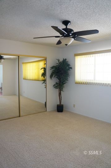 325 Traci Lane Ridgecrest, CA 93555 - Photo 11 of 13 a view of empty room with a fan