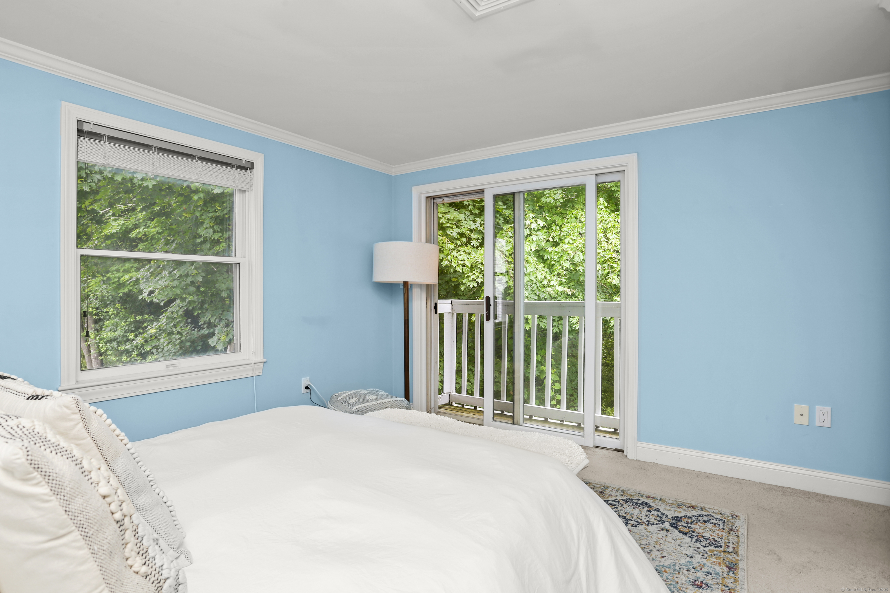 110 Weaver Street, Unit B Greenwich, CT 06831 - Photo 11 of 19 a bedroom with a bed and a window