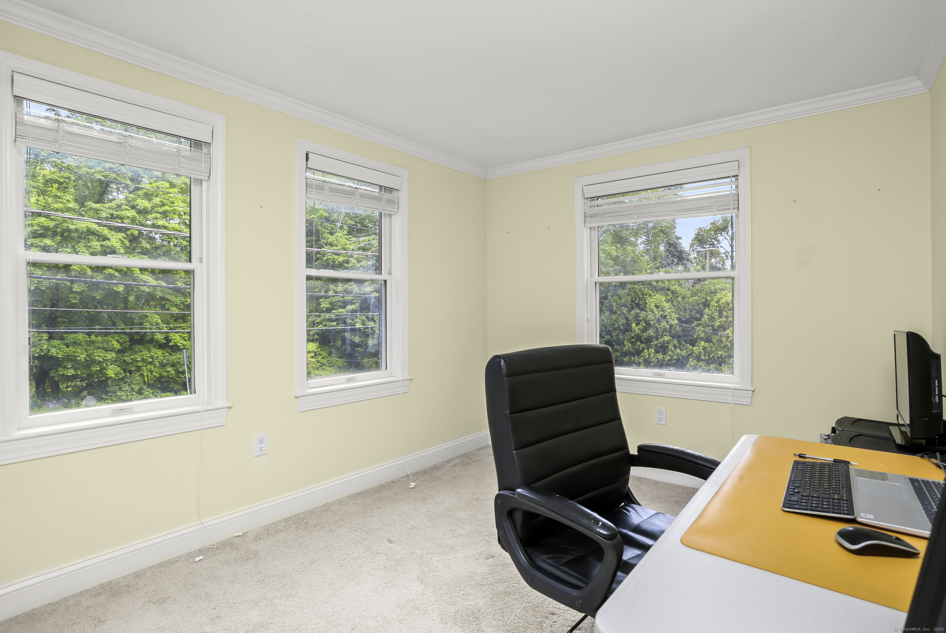 110 Weaver Street, Unit B Greenwich, CT 06831 - Photo 12 of 19 a living room with furniture and a window