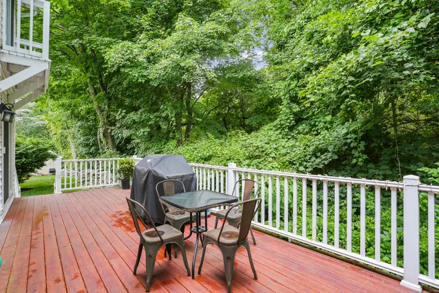 a view of a wooden bench on the deck