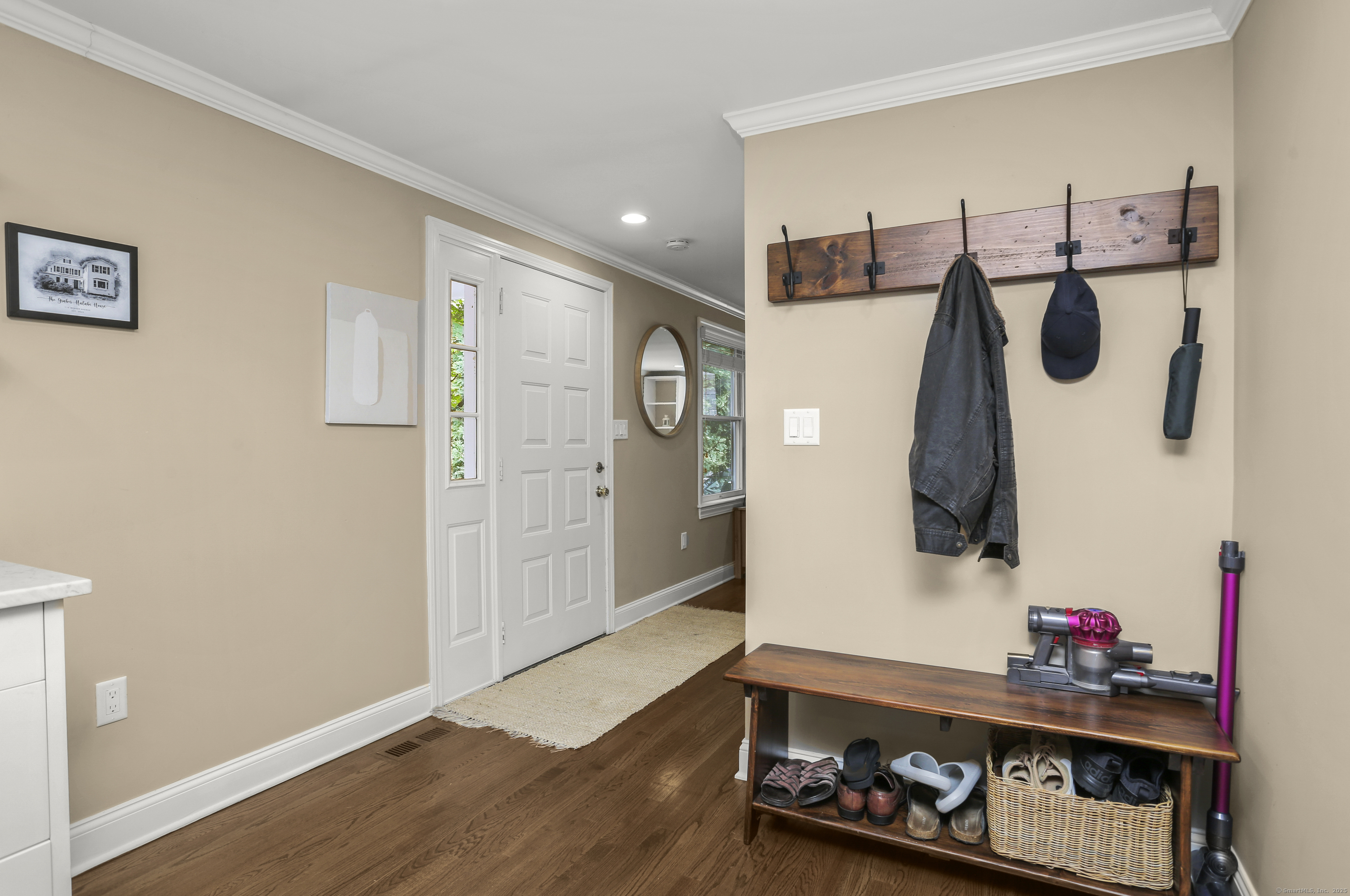 110 Weaver Street, Unit B Greenwich, CT 06831 - Photo 3 of 19 a room with furniture and wooden floor