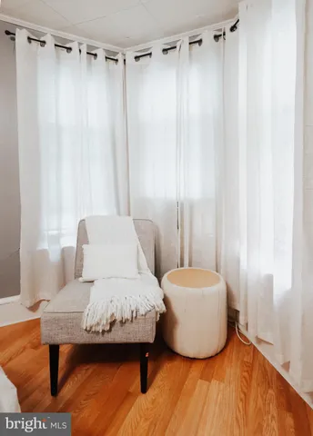 a bedroom with a bed and a mirror