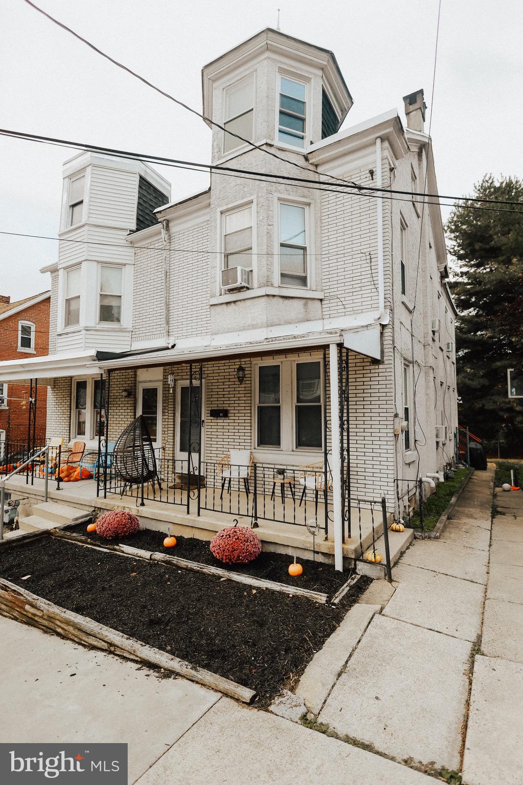 11 Seminary Avenue Reading, PA 19605 - Photo 14 of 15 a front view of a residential apartment building with a yard