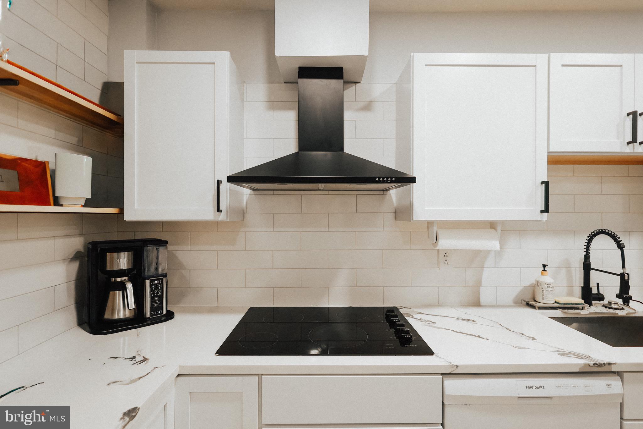 11 Seminary Avenue Reading, PA 19605 - Photo 2 of 15 a kitchen with a sink and cabinets
