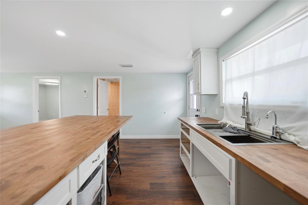 8164 Archie Street Englewood, FL 34224 - Photo 11 of 42 a kitchen with a stove and a sink