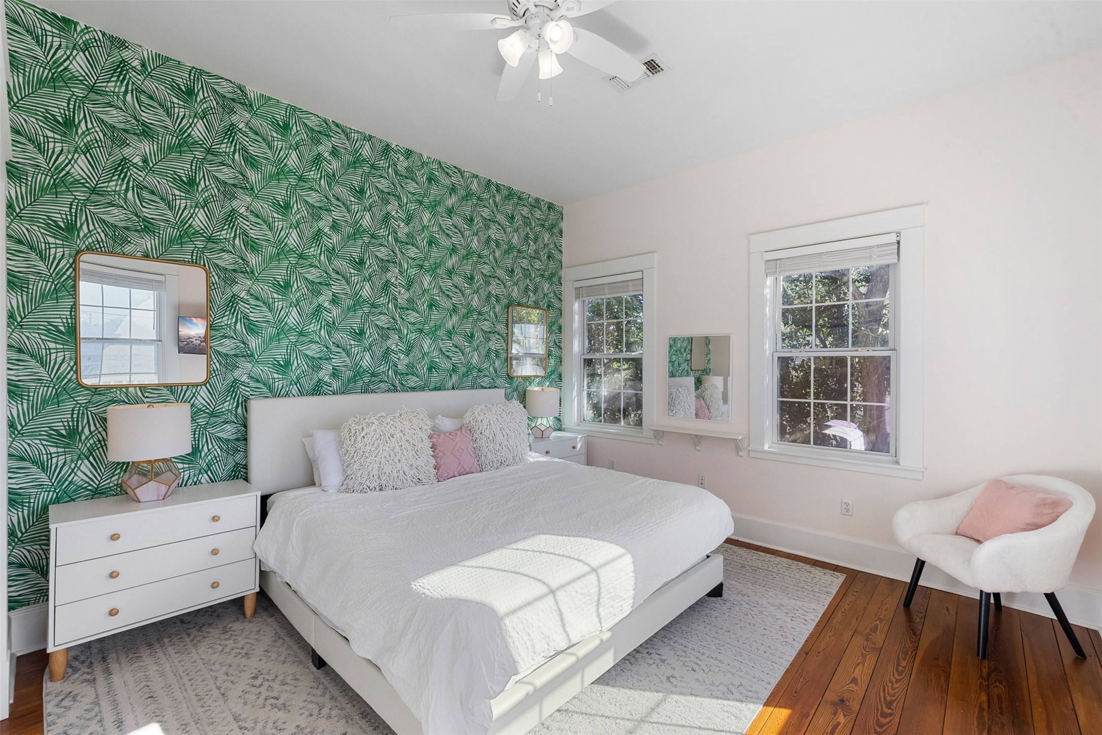 407 East Alamo Street Brenham, TX 77833 - Photo 18 of 27 a bedroom with a bed and a chandelier