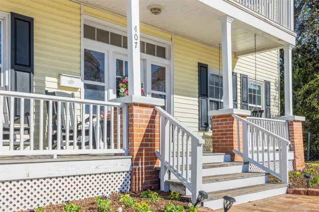 a view of a brick building from a porch