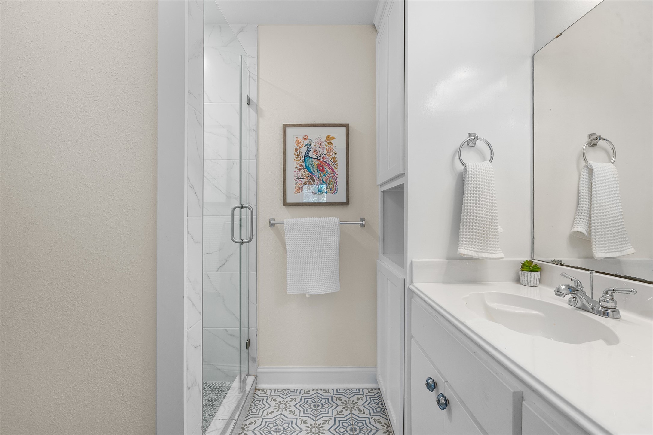 407 East Alamo Street Brenham, TX 77833 - Photo 22 of 27 a bathroom with a sink and a mirror