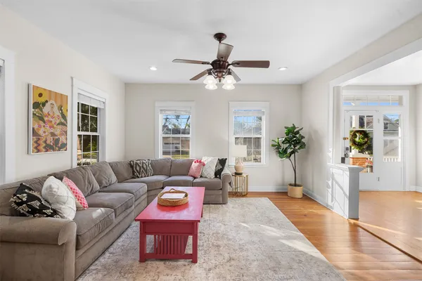 a living room with furniture and a large window