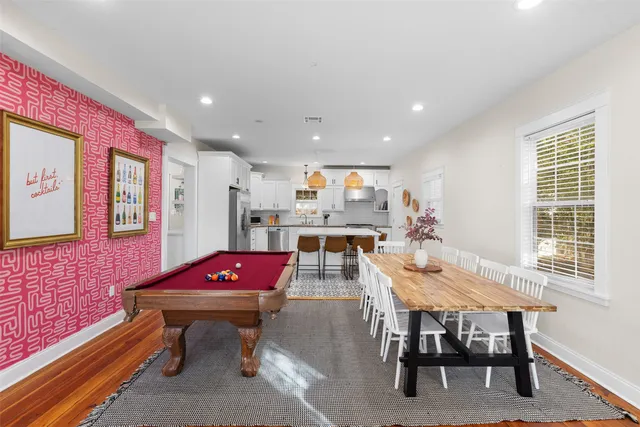 a dining room with furniture and window