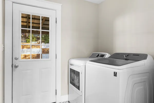 a utility room with dryer and washer