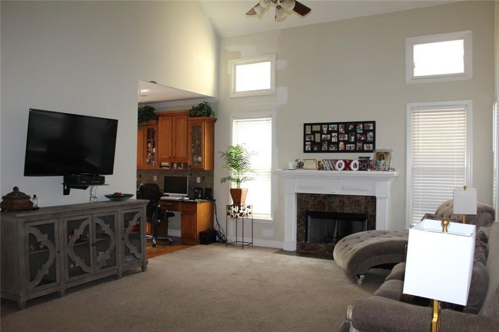3411 Jim Moore Road Dacula, GA 30019 - Photo 12 of 54 a living room with furniture and a flat screen tv