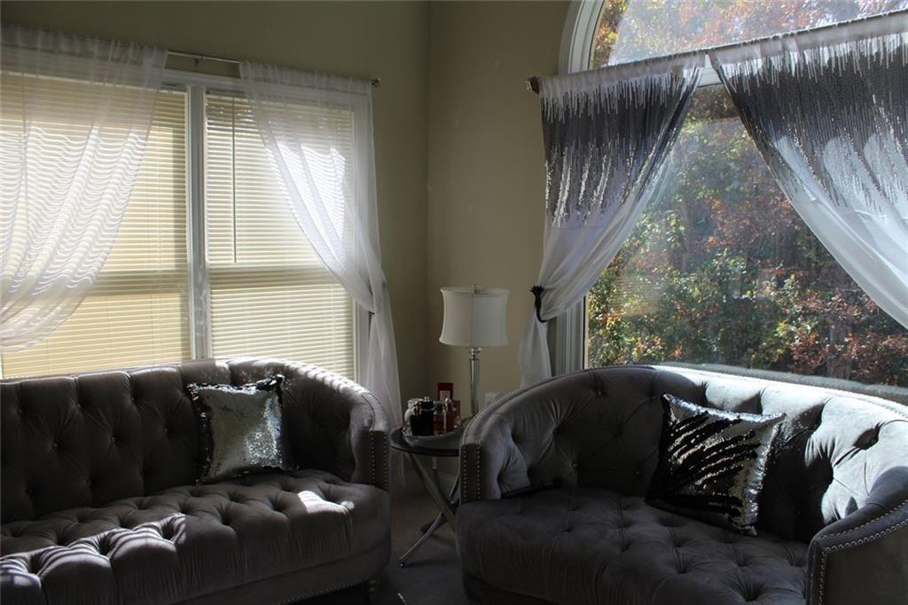 3411 Jim Moore Road Dacula, GA 30019 - Photo 27 of 54 a living room with furniture and a large window
