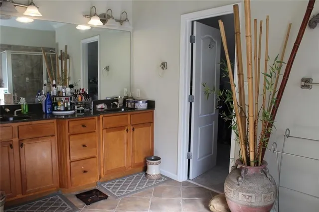 a view of walk in closet with clothes