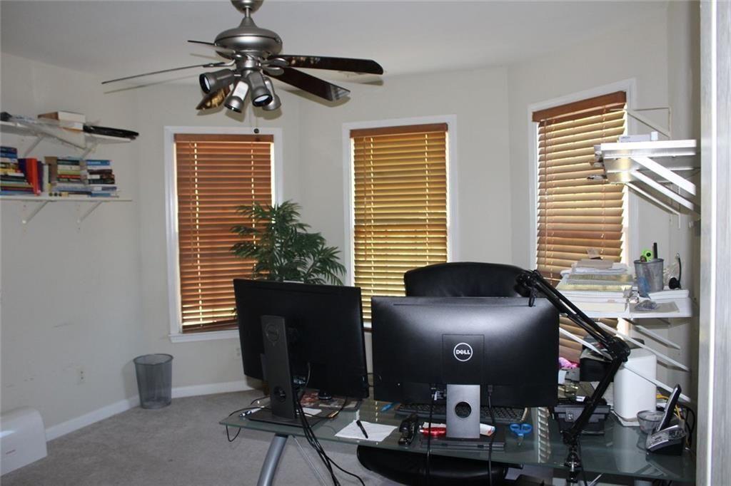 3411 Jim Moore Road Dacula, GA 30019 - Photo 36 of 54 a view of a workspace with furniture and a window