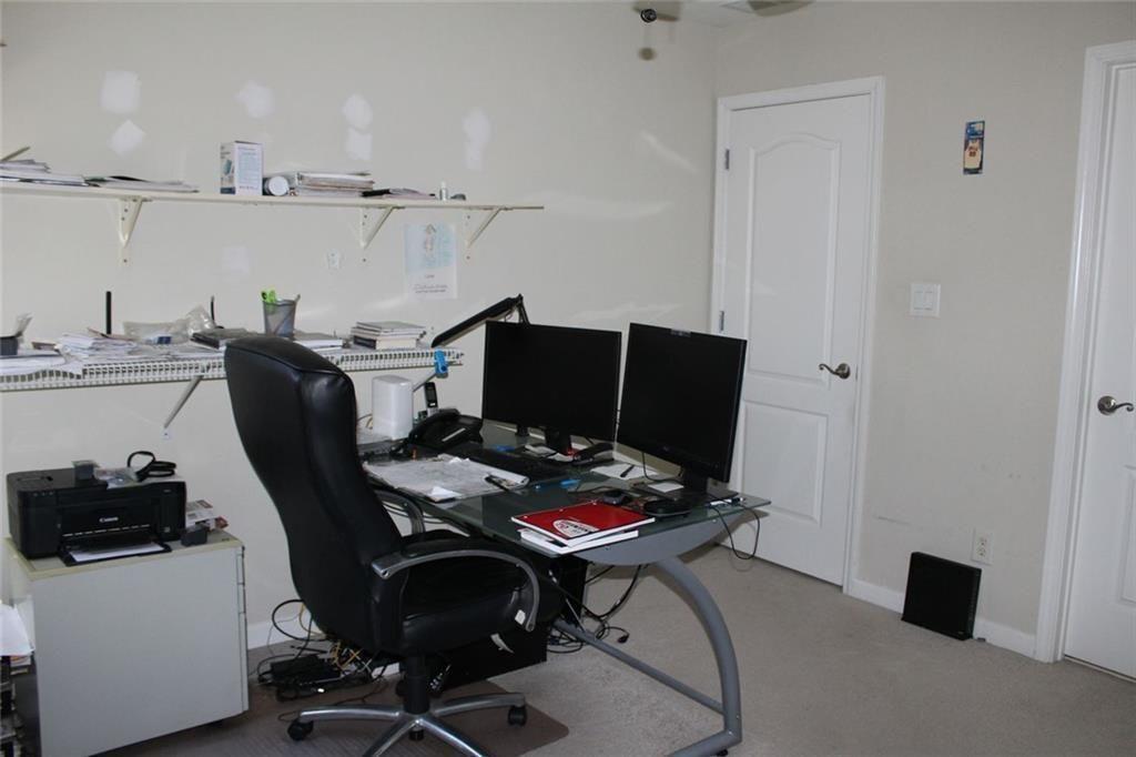 3411 Jim Moore Road Dacula, GA 30019 - Photo 37 of 54 a work room with furniture and furniture