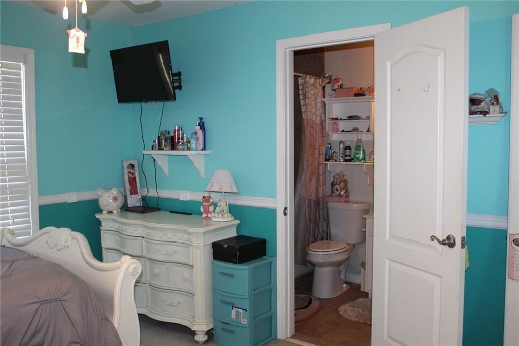 3411 Jim Moore Road Dacula, GA 30019 - Photo 44 of 54 a bathroom with a sink toilet and a mirror