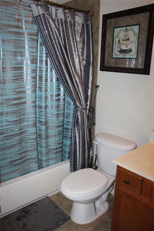 3411 Jim Moore Road Dacula, GA 30019 - Photo 48 of 54 a bathroom with a toilet and a shower