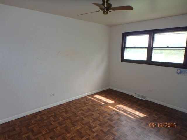 557 Old Meadow Road Matteson, IL 60443 - Photo 11 of 16 an empty room with a window