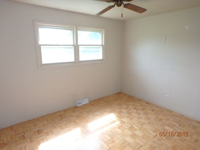 557 Old Meadow Road Matteson, IL 60443 - Photo 12 of 16 an empty room with a window