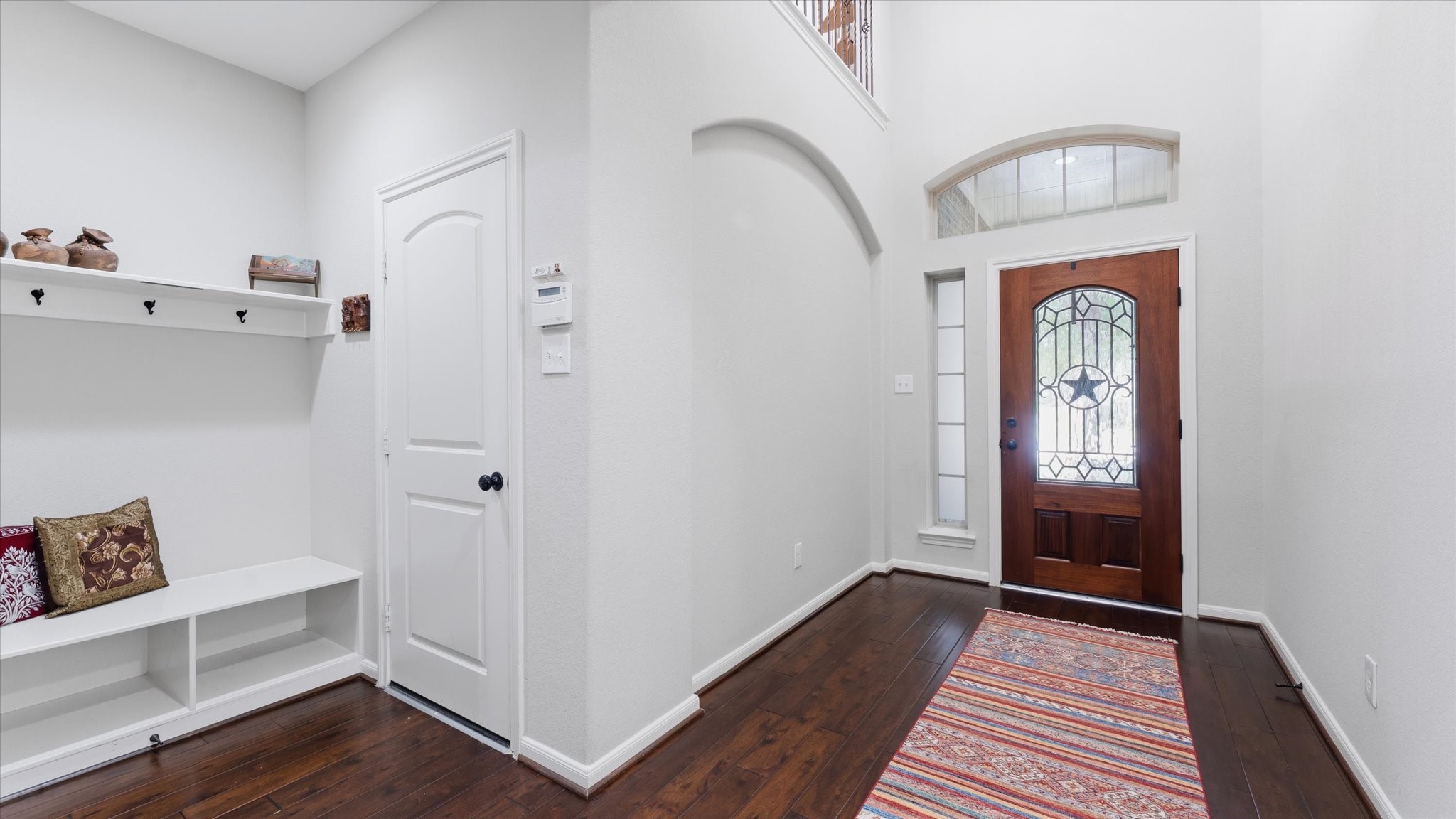 14 Painted Post Place Spring, TX 77389 - Photo 7 of 43 a view of entryway with wooden floor