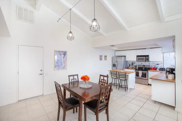 a view of a dining room with furniture and a dining table