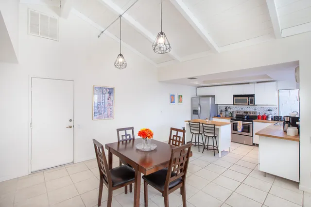 a view of a dining room with furniture and a dining table