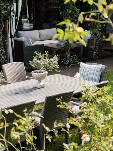 a view of a chairs and table in patio