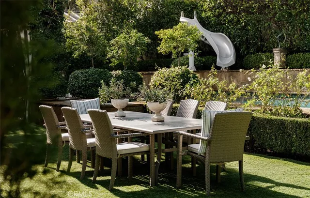 a bathroom with a granite countertop sink mirror and toilet