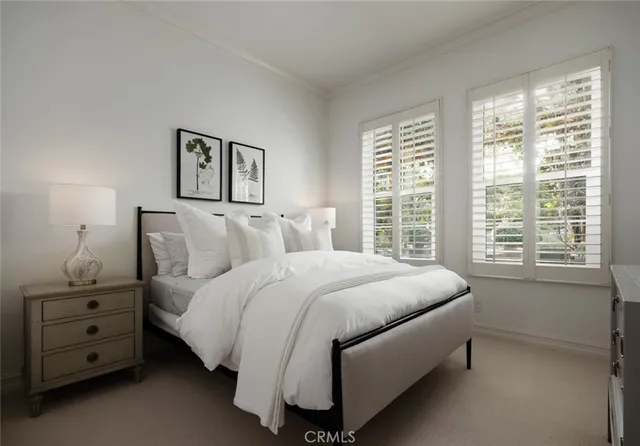 a spacious bathroom with double vanity and a mirror
