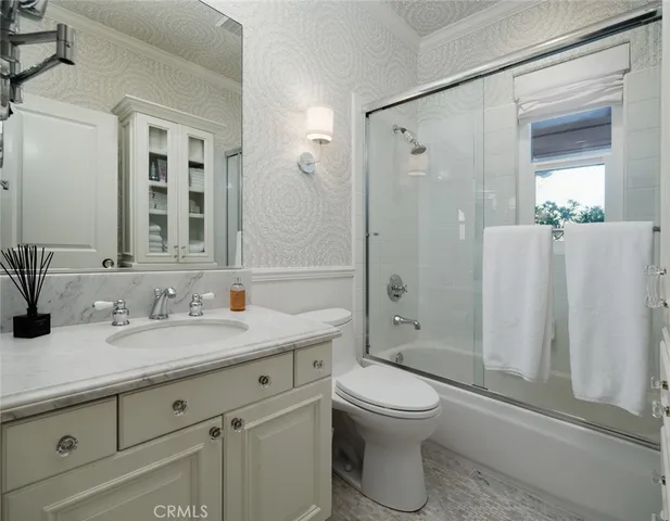 an aerial view of residential houses with city view